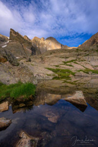 Vertical Photo of Dappled Light on Longs Peak Reflecting in Seasonal Alpine Pond Below Chasm Lake RMNP Colorado