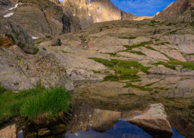 Vertical Photo of Dappled Light on Longs Peak Reflecting in Seasonal Alpine Pond Below Chasm Lake RMNP Colorado