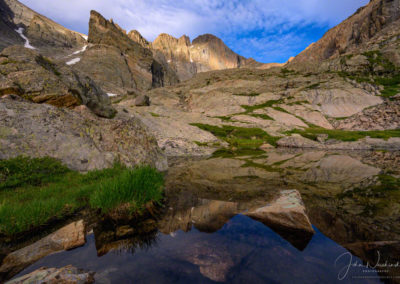 Photo of Dappled Light on Longs Peak Reflecting in Seasonal Alpine Pond Below Chasm Lake RMNP Colorado