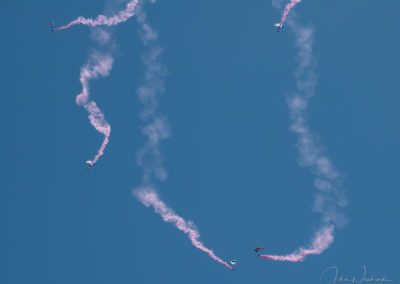 US Air Force Wings of Blue Parachute Team Members High Up in the Sky with Smoke Trails