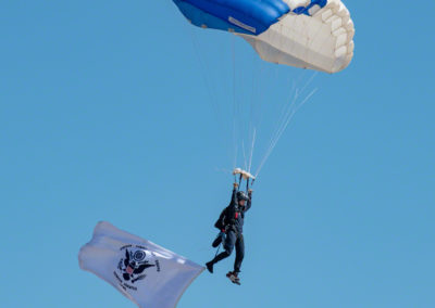 US Air Force Wings of Blue Parachute Team Member Flying the Colors for the US Coast Guard