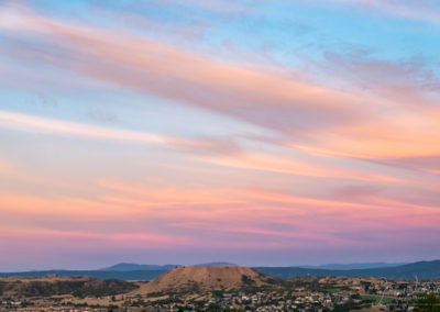 Blue Skies and Pastel Wispy Clouds at Sunrise over Castle Rock CO