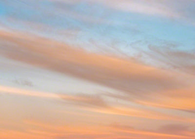 Blue Skies Yellow and Orange High Wispy Clouds over Castle Rock Colorado at Sunrise