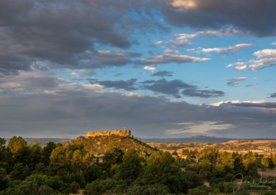 High Dramatic White Clouds over The Illuminated Rock - Castle Rock CO
