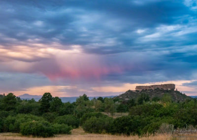 Shafts of Purple Colored Virga at Sunrise over Castle Rock Colorado - Pikes Peak