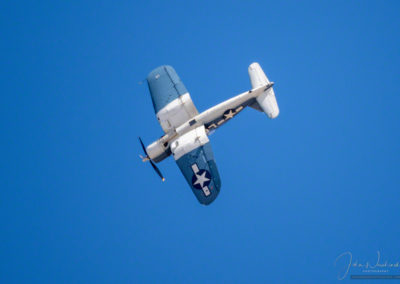 Aerial maneuver of Brewster F3A Corsair at Pikes Peak Airshow in Colorado Springs