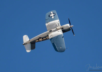 Aerial roll of Brewster F3A Corsair at Pikes Peak Airshow in Colorado Springs