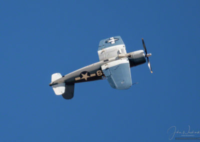 In-flight roll of Brewster F3A Corsair at Pikes Peak Airshow in Colorado Springs
