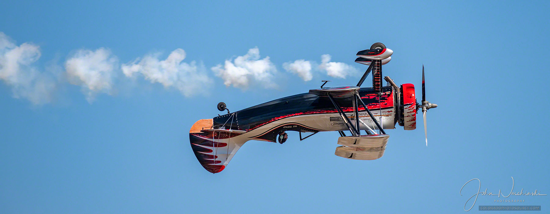Photo of Kyle Franklin Dracula Custom Biplane Flying Inverted at Colorado Springs Airshow