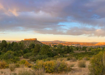Panoramic Photo of First Light on The Rock at Sunrise in this Photo of Castle Rock Colorado