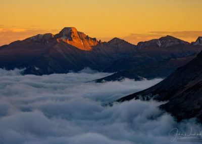 Photo of Longs Peak at Sunset with Clouds in Valley Below