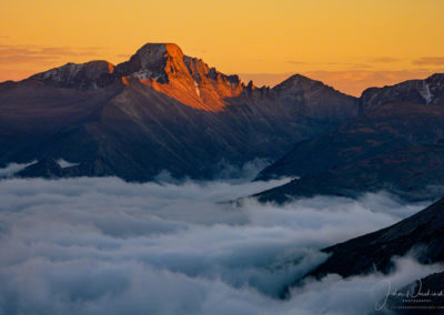 Colorful Sunset Photo of Longs Peak with Fog & Clouds in Valley Below