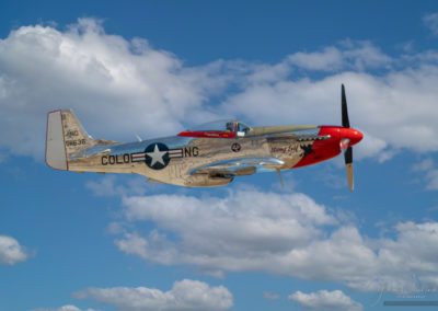 Profile in Flight Photo of P-51D Stang Evil at Colorado Springs Airshow