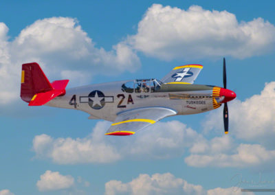Photo of The CAF Red Tail Squadron’s P-51C Mustang, Tuskegee Airmen in Flight at Pikes Peak Regional Airshow
