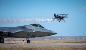 Kyle Franklin in Dracula Biplane with F22 awaiting takeoff at Colorado Springs Airshow