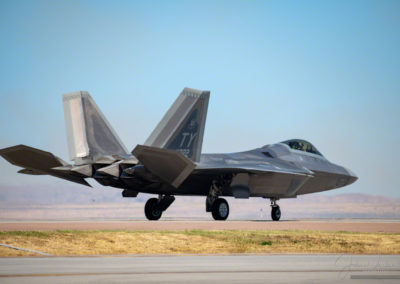 Lt. Col. Paul “Loco” Lopez Commander and Pilot taxing F-22 on Runway