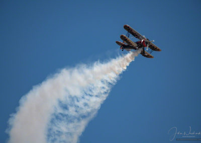 Kyle Franklin in Dracula Biplane performing aerial acrobatics Colorado Springs Airshow