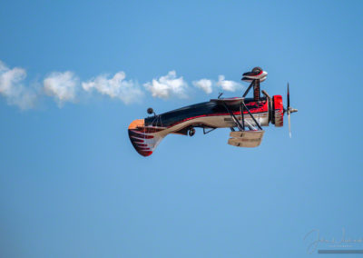 Kyle Franklin in Dracula Biplane performing low pass inverted at Pikes Peak Regional Airshow