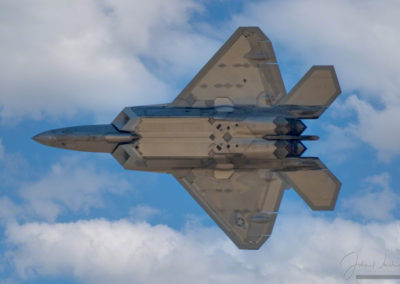 Flyby of F-22 Raptor Presenting Underside of Aircraft