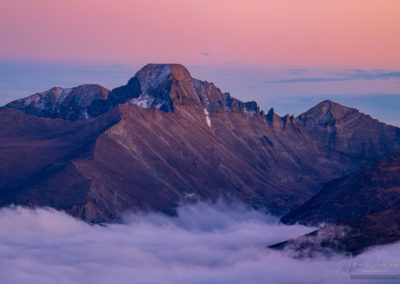 Pink Magenta Post Sunset Glow Photo of Longs Peak with Layers of Fog in Valley Below - RMNP