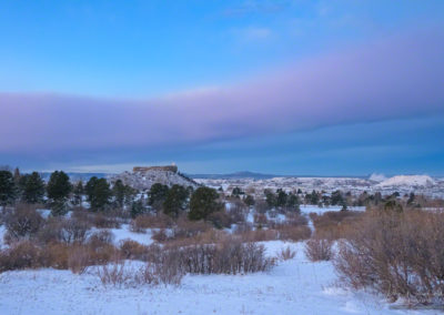 Pre-Dawn Light with Blue Skies and Purple Bow Cloud over Castle Rock CO