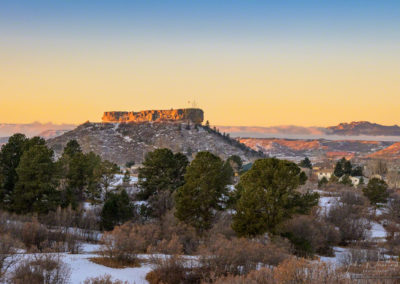 Photo of Castle Rock CO with Low Lying Fog along the Front Range and Devil's Head in Background