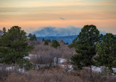 Clouds Cling to Pikes Peak in this Sunrise Photo as Viewed from Castle Rock CO