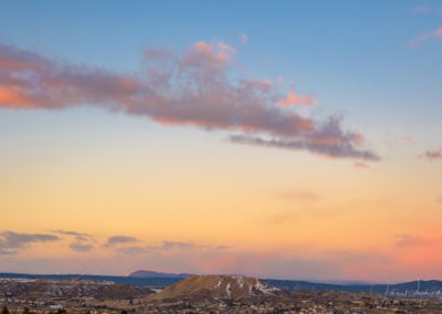 Pink and Orange Clouds over Castle Rock in Autumn