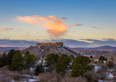 Stray Clouds over the Rock as First Light Illuminates at Sunrise Castle Rock CO