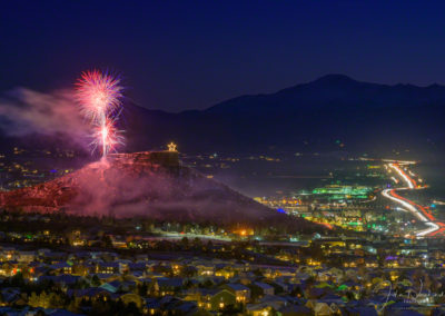 Fireworks over the Rock in Castle Rock Colorado with Majestic Pikes Peak in Background at the Annual Star Lighting Ceremony