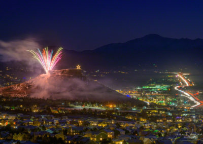 Colorful Fireworks over the Rock in Castle Rock Colorado with Majestic Pikes Peak in Background at the Annual Starlighting Ceremony