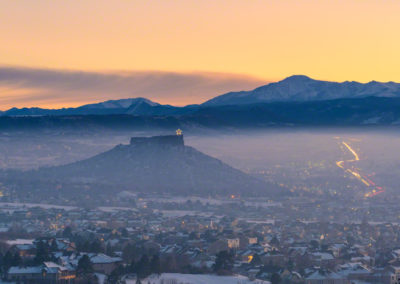 Panoramic Evening Photo of Castle Rock Star and Pikes Peak with Haze and Fog