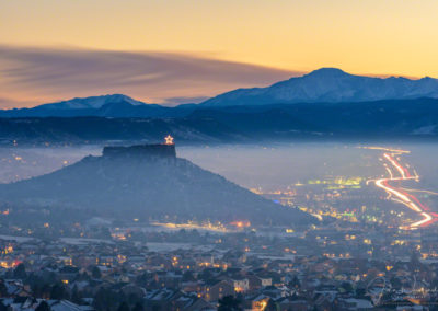 Photos of Illuminated Castle Rock Star and Pikes Peak Above the Fog