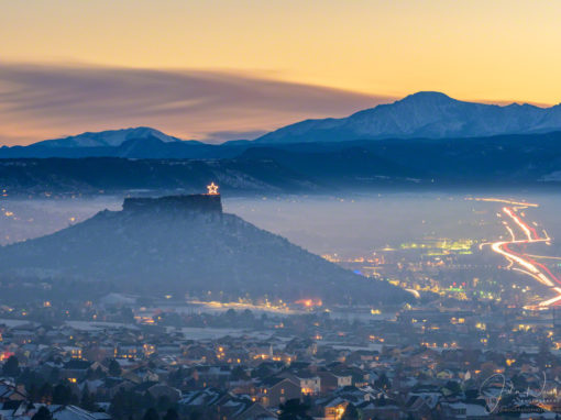 Photos of Illuminated Castle Rock Star and Pikes Peak Above the Fog