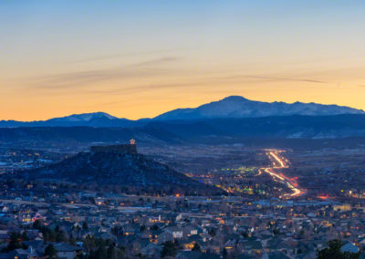 Wide Evening Panoramic Photo of Castle Rock Colorado Valley and Pikes Peak with Cars on I-25
