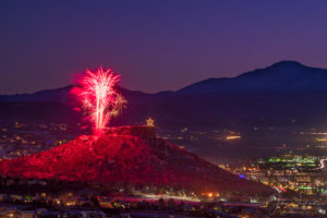 Close up of Fireworks Show over the Rock in Castle Rock Colorado with Majestic Pikes Peak in Background at the Annual Starlighting Ceremony