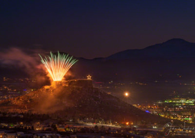 Colorful Fireworks Show over the Rock in Castle Rock Colorado with Pikes Peak in Background at the Annual Starlighting Ceremony
