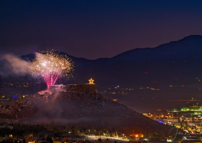 Sparkling Fireworks Show over the Rock in Castle Rock Colorado with Pikes Peak in Background at the Annual Starlighting Ceremony