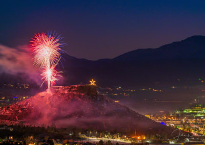 Smoke from Fireworks Drift over the Rock in Castle Rock Colorado with Pikes Peak in Background at the Annual Starlighting Ceremony