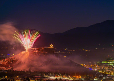 Colorful Fireworks over the Rock in Castle Rock Colorado with Pikes Peak in Background at the Annual Starlighting Ceremony