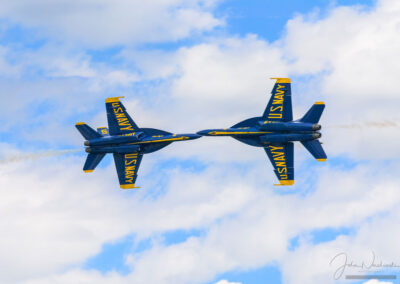 Photo 1 of two Blue Angel F/A-18s Opposing Knife Edge Maneuver