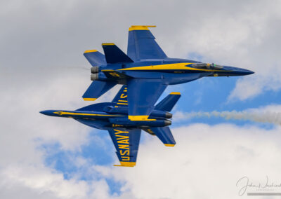 Photo of Two Blue Angel F/A-18s Opposing Knife Edge Pass