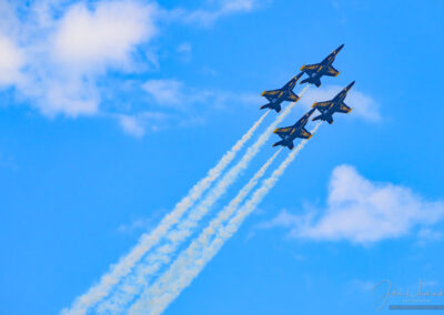 Photo of Blue Angel F/A-18s in a Delta Roll